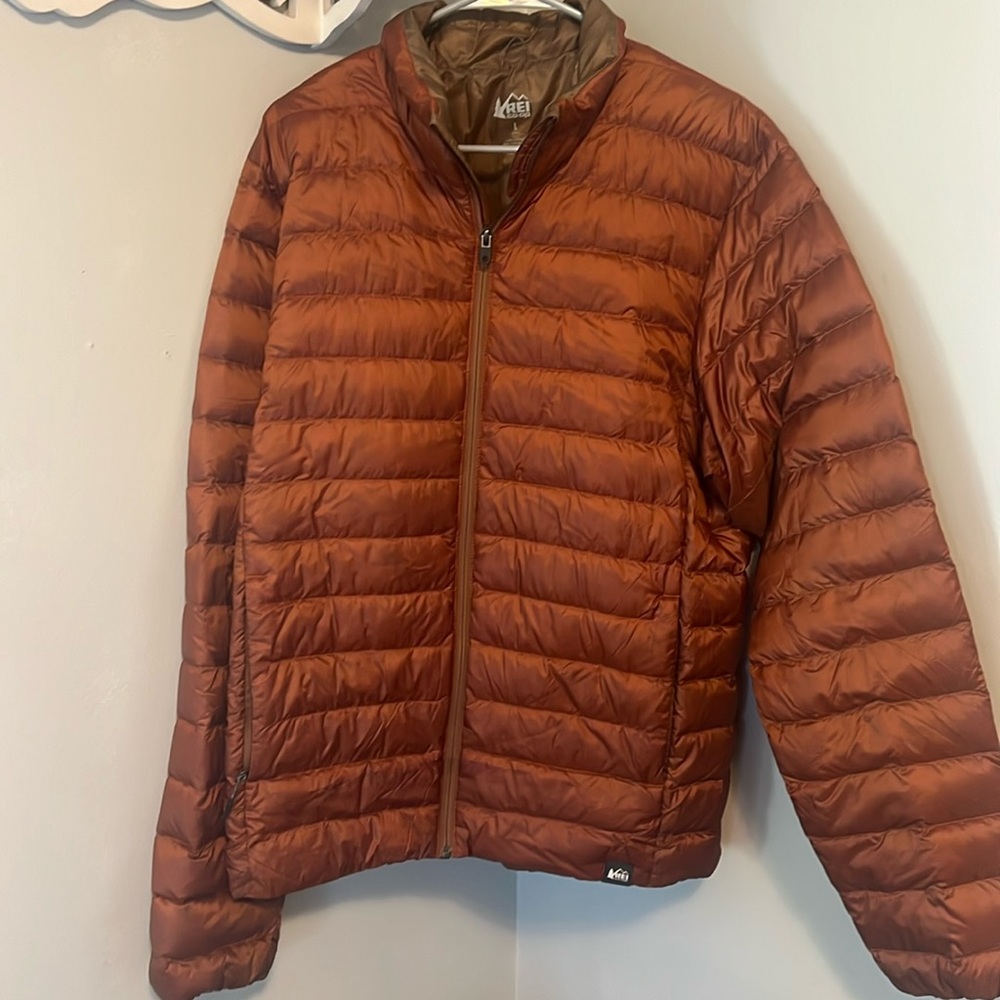 REI men’s burnt orange jacket